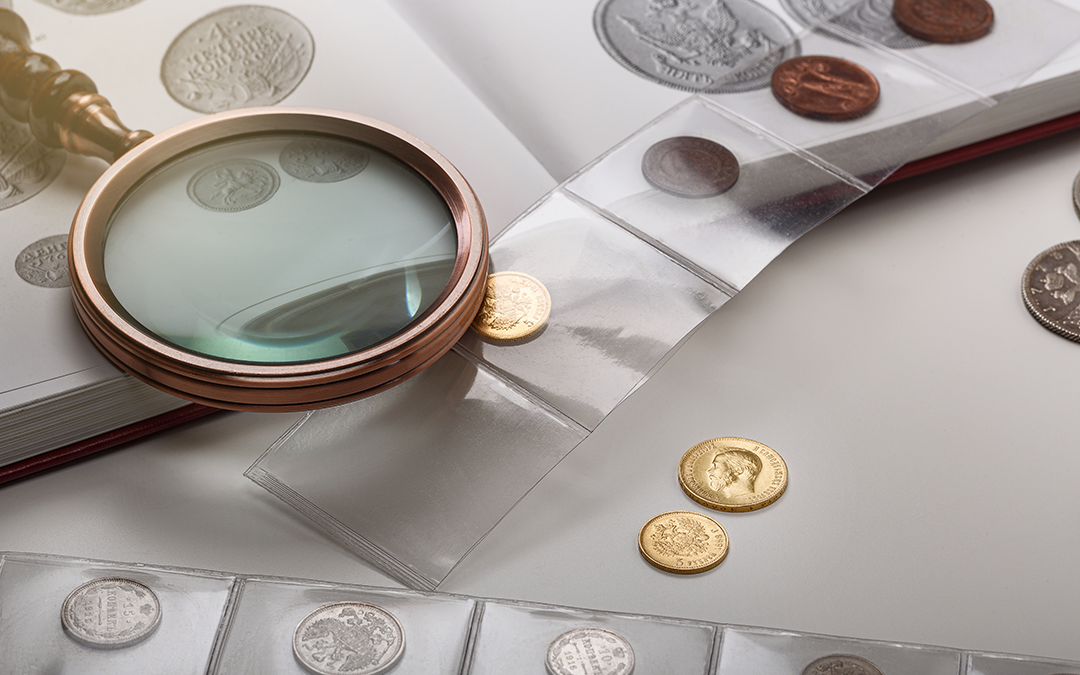Old collectible coins on a table. light background.
