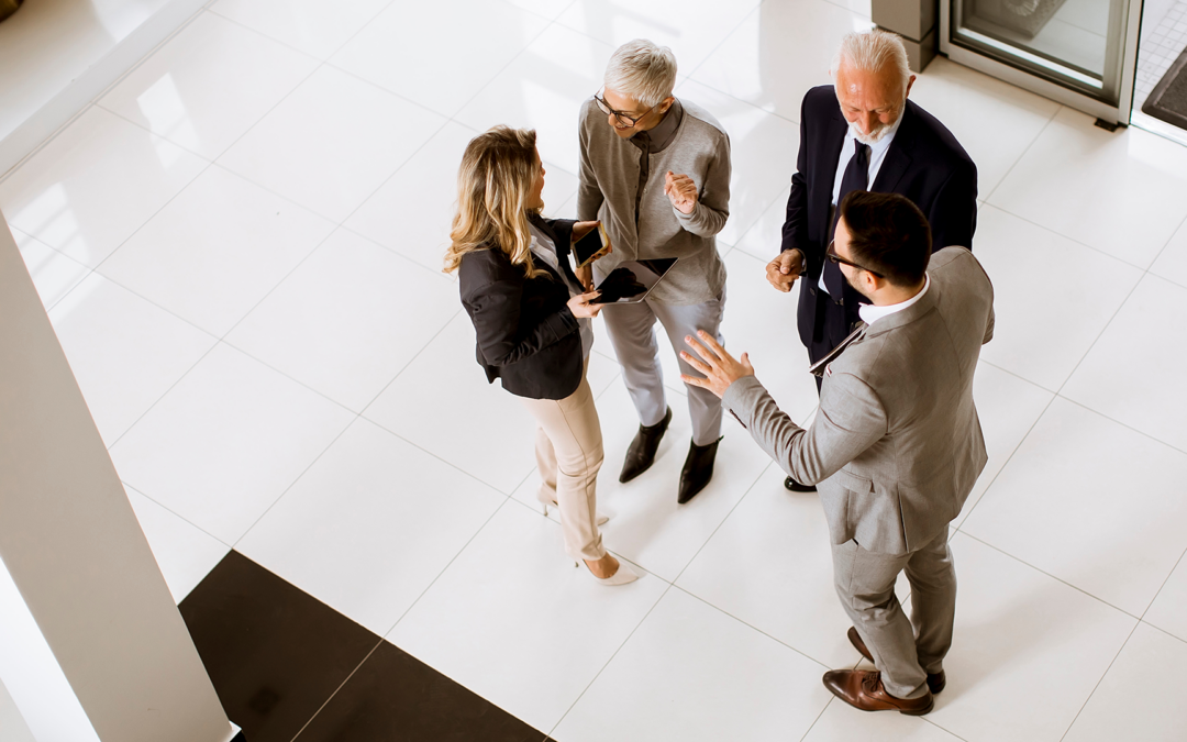 group of professionals talking in a lobby