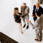 group of professionals talking in a lobby